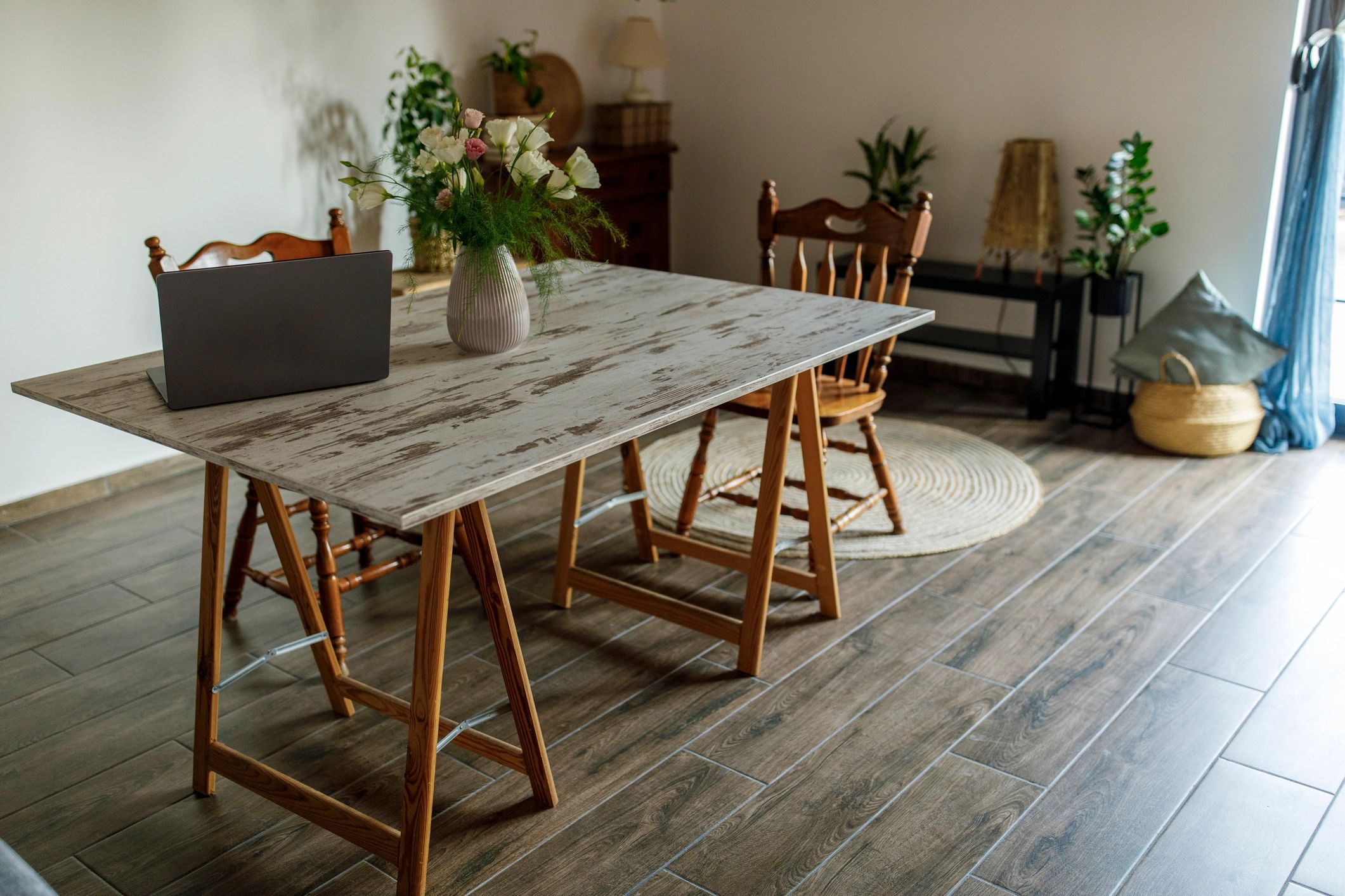 Minimal dining table styled with flowers and soft neutral decor