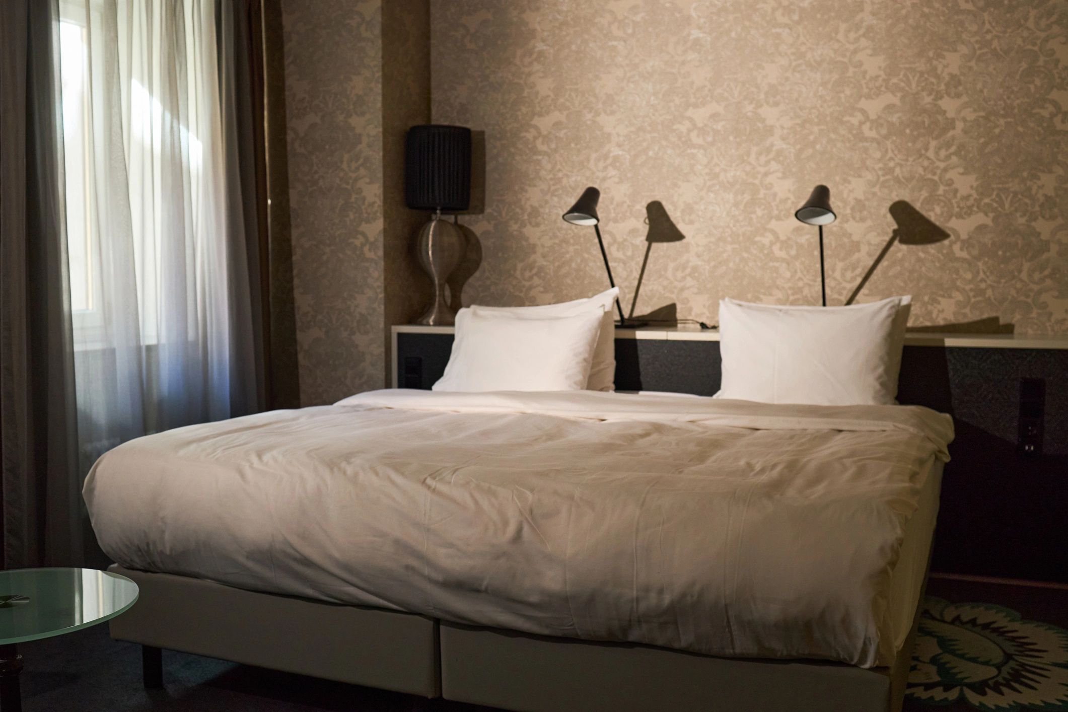 Styled bedroom featuring layered decorative pillows
