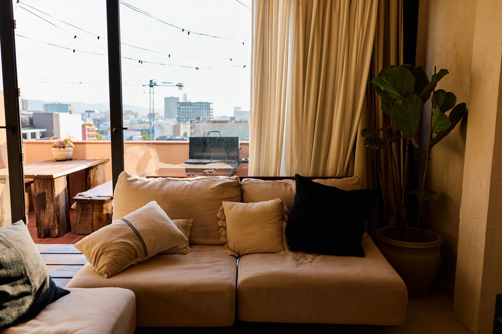 Neutral sofa styled with decorative throw pillows