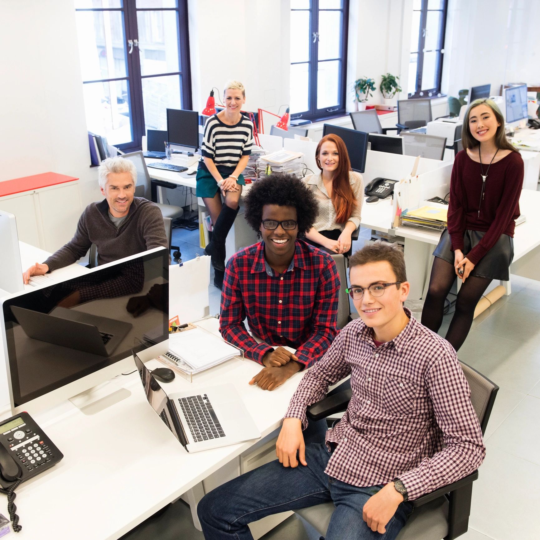 Creative team collaborating behind the HUGLINA brand